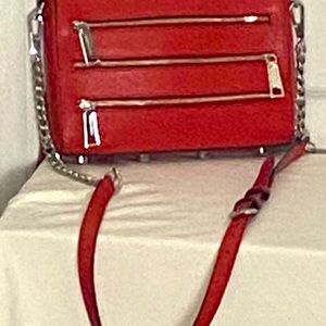 Cute red mini zippered Rebecca Minkoff crossbody. Barely worn. NO signs of wear